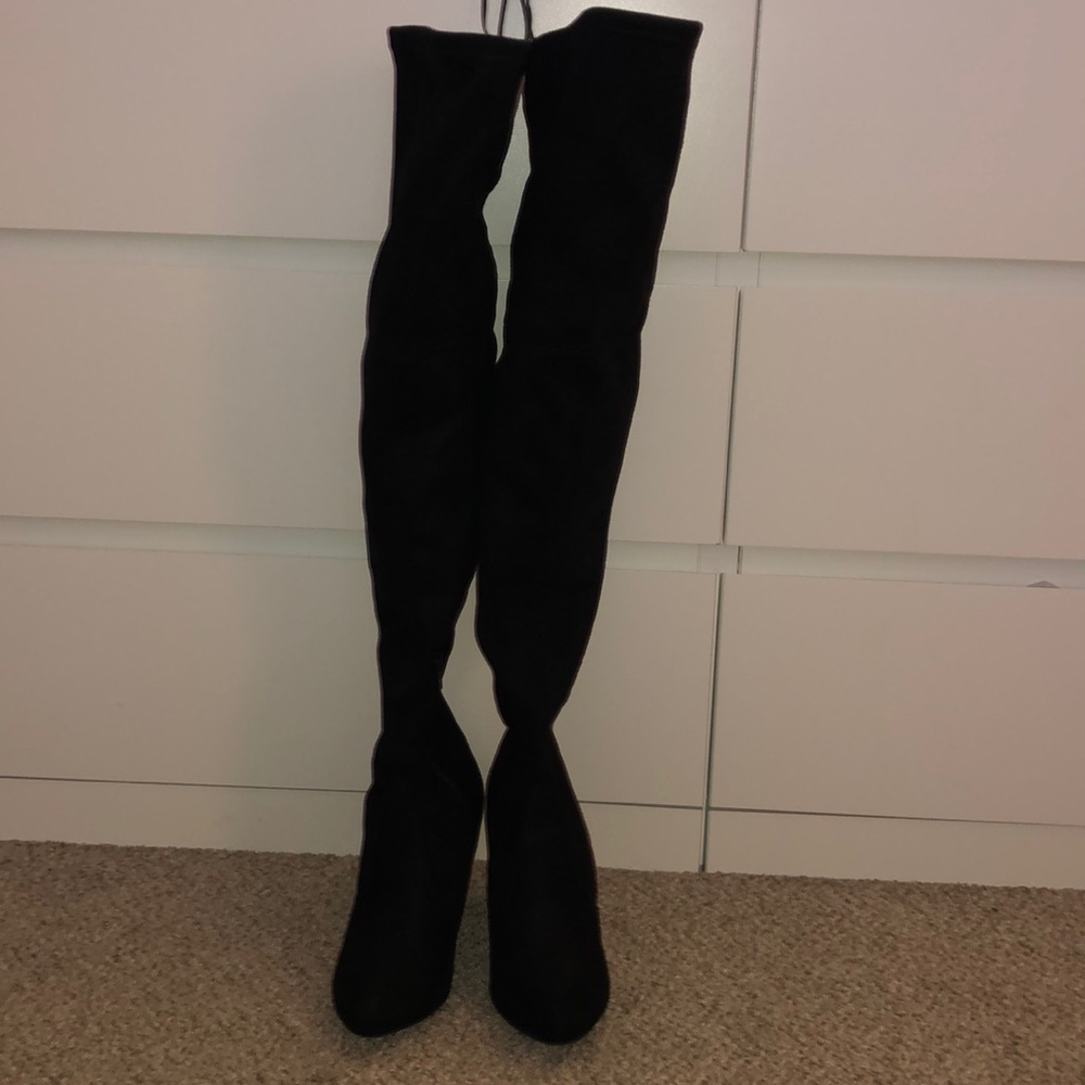 Thigh high black boot